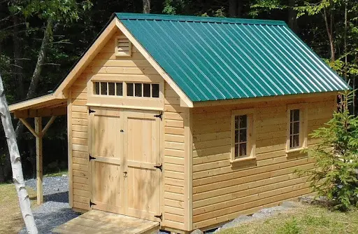a shed with metal roof and overhang built in Waterbury Center Vermont